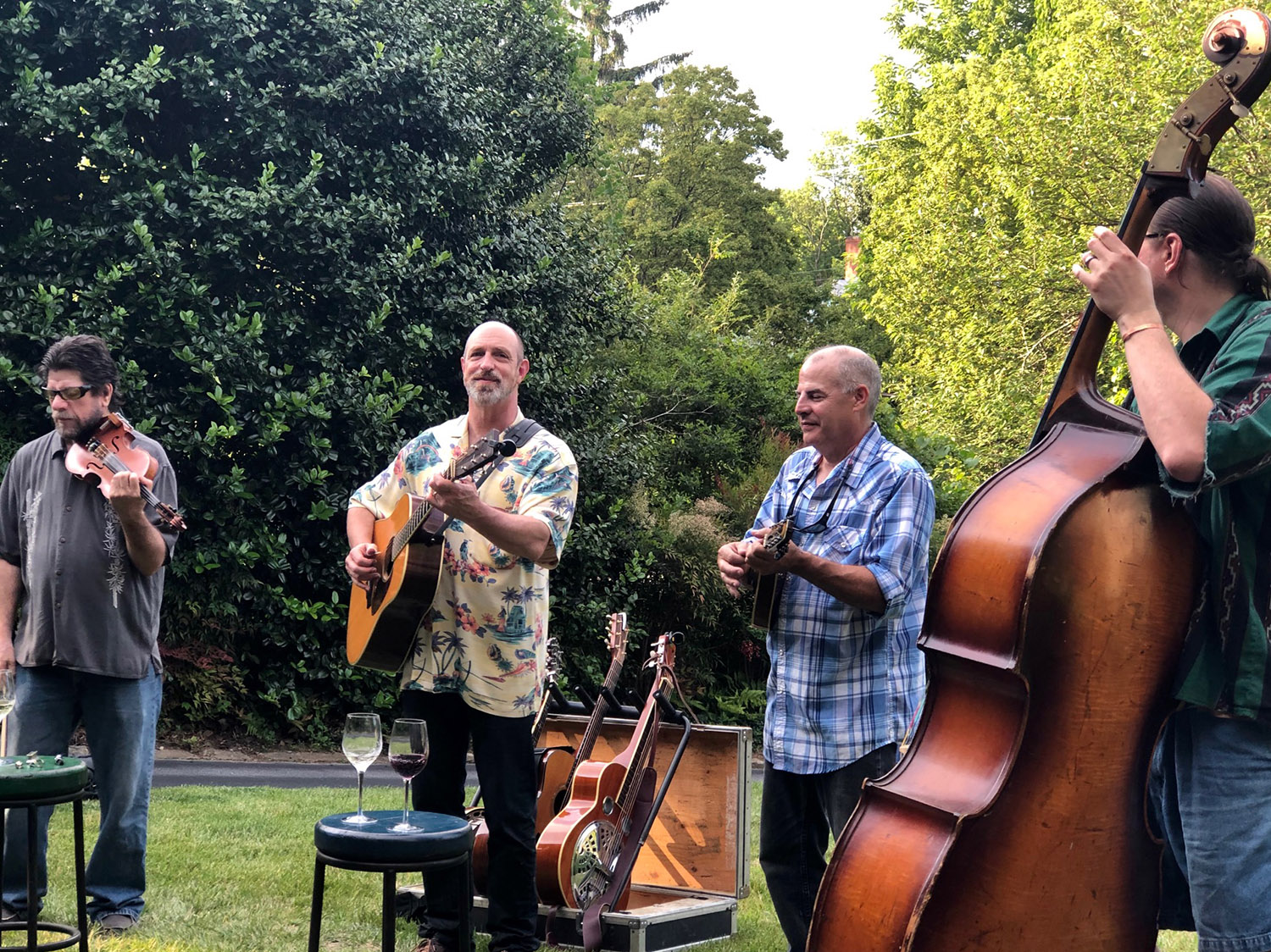 Music on the porch performed by a local Asheville guitar player. The audience is seated on chairs in a circle.