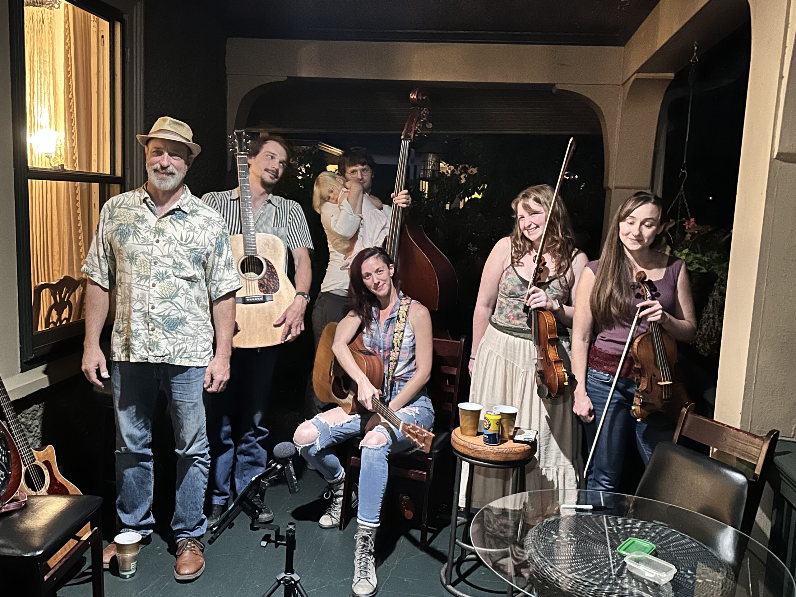 Local bluegrass musicians on the front porch at 1900 Inn on Montford