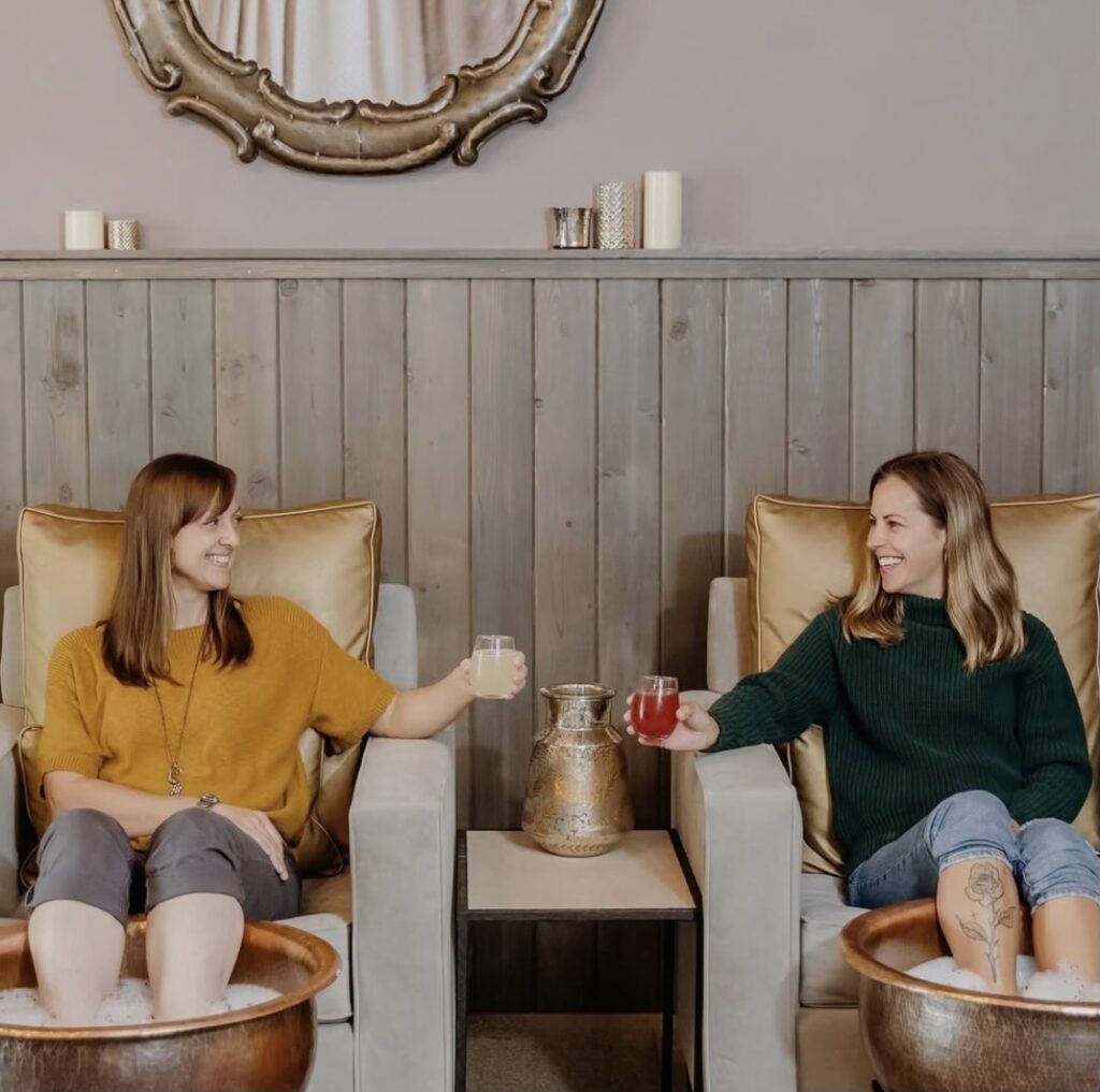 Two women enjoying a foot soak at Wake Foot Sanctuary